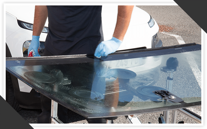 Areas We Serve Image A image of a man fixing a windshield